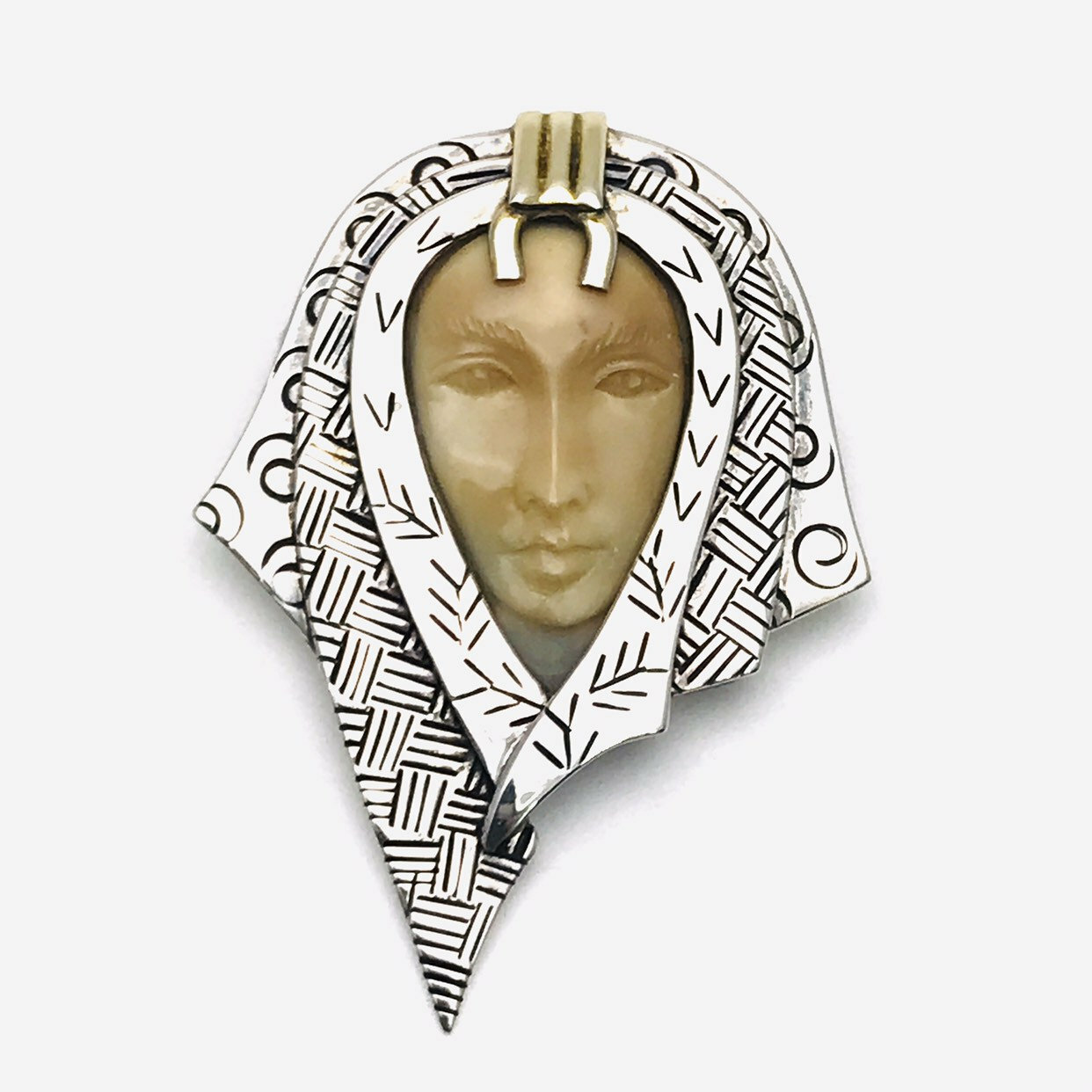Zealandia Pendant Brooch, Woman wearing a head scarf, Sterling Silver and carved fossil tusk.