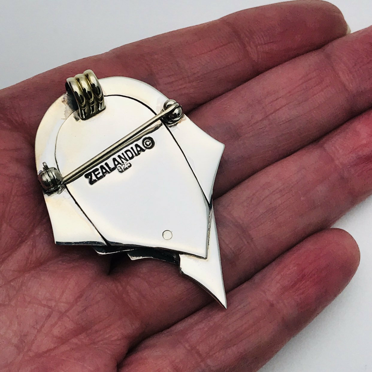 Zealandia Pendant Brooch, Woman wearing a head scarf, Sterling Silver and carved fossil ivory tusk.