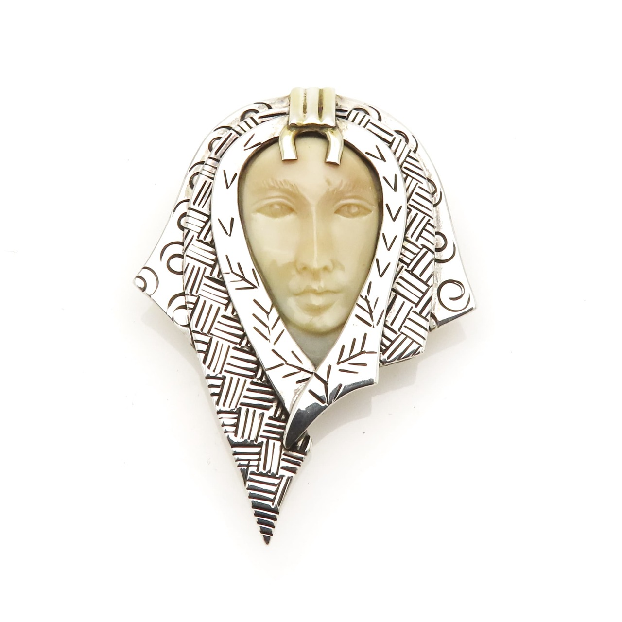 Zealandia Pendant Brooch, Woman wearing a head scarf, Sterling Silver and carved fossil tusk.