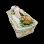 Antique Victorian trinket box hand offering flowers by S&S Limoges.