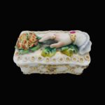 Antique Victorian trinket box hand offering flowers by S&S Limoges.
