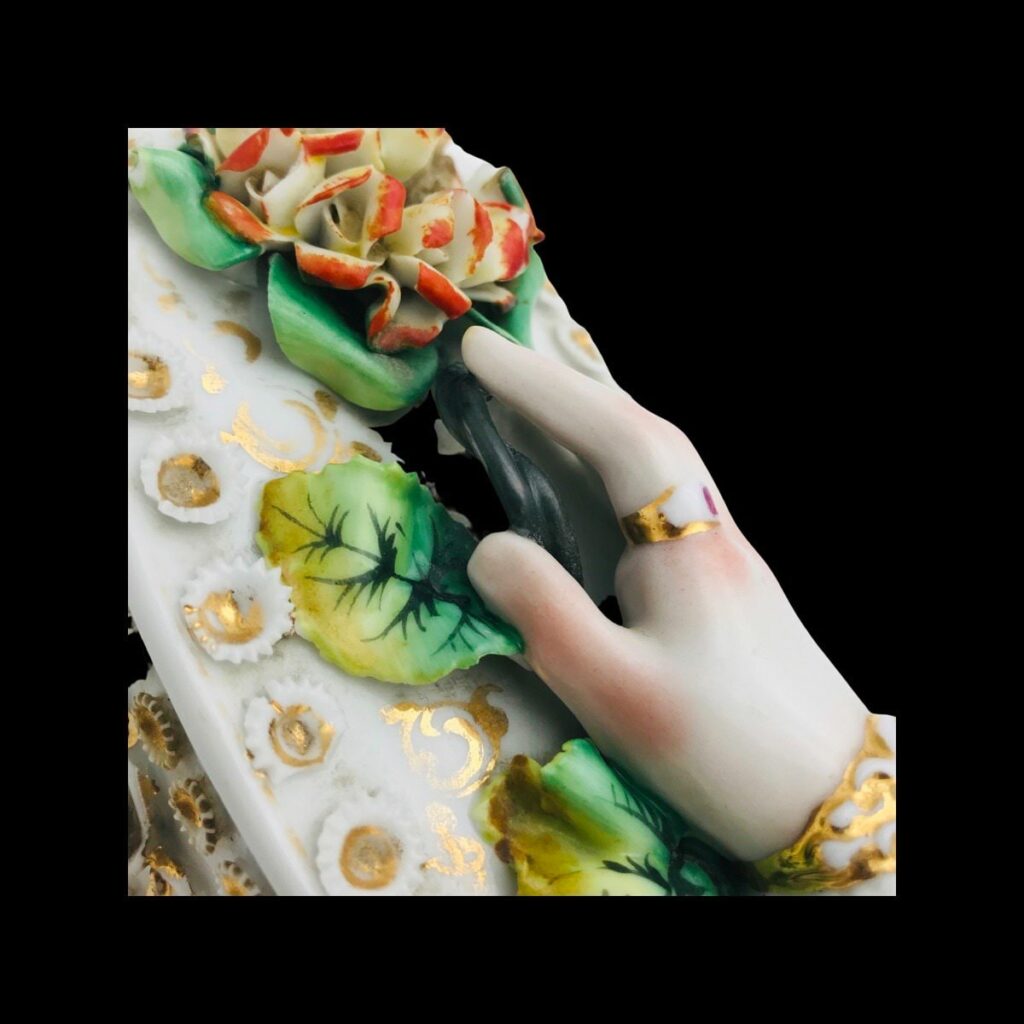 Antique Victorian trinket box hand offering flowers by S&S Limoges.