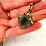 Antique Victorian chunky pocket watch chain with intaglio fob.