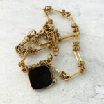 Antique Victorian chunky pocket watch chain with intaglio fob.