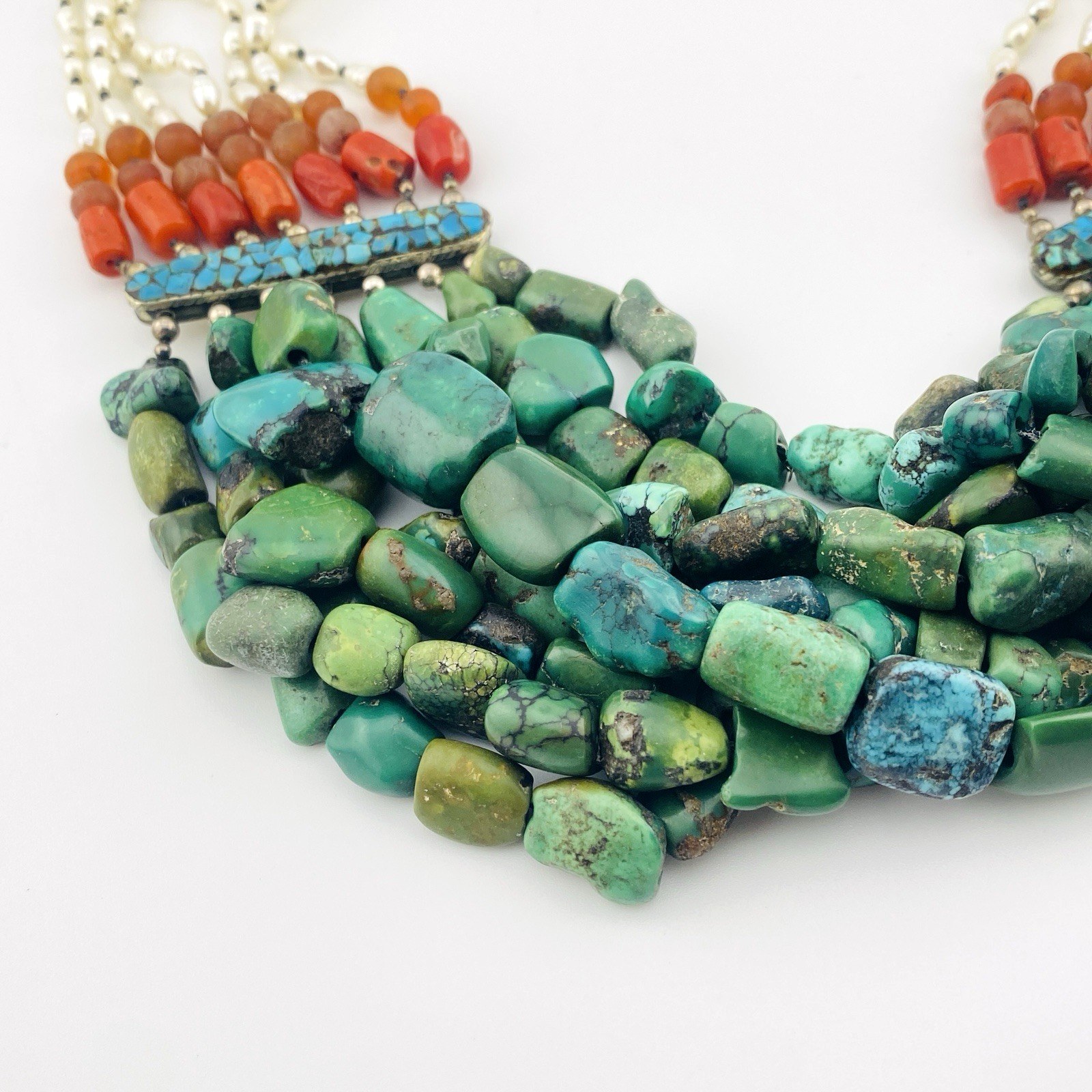 Vintage Tibetan silver necklace featuring turquoise, Coral, baroque pearls, and Carnelian