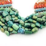 Vintage Tibetan silver necklace featuring turquoise, Coral, baroque pearls, and Carnelian