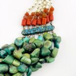 Vintage Tibetan silver necklace featuring turquoise, Coral, baroque pearls, and Carnelian