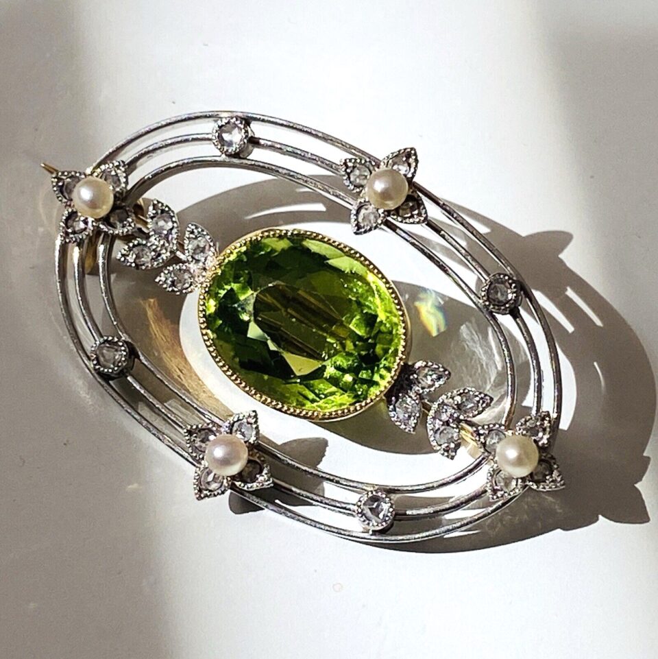 Peridot Diamond Pearl Platinum and Gold Brooch Pin from the Edwardian Era