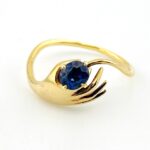 Hand Offering a Sapphire 14k Gold Ring