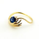 Hand Offering a Sapphire 14k Gold Ring