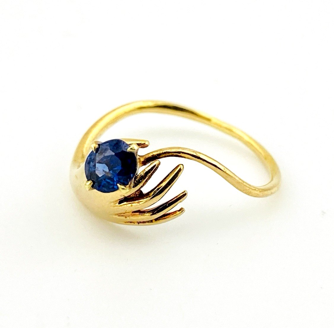 Hand Offering a Sapphire 14k Gold Ring