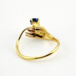 Hand Offering a Sapphire 14k Gold Ring