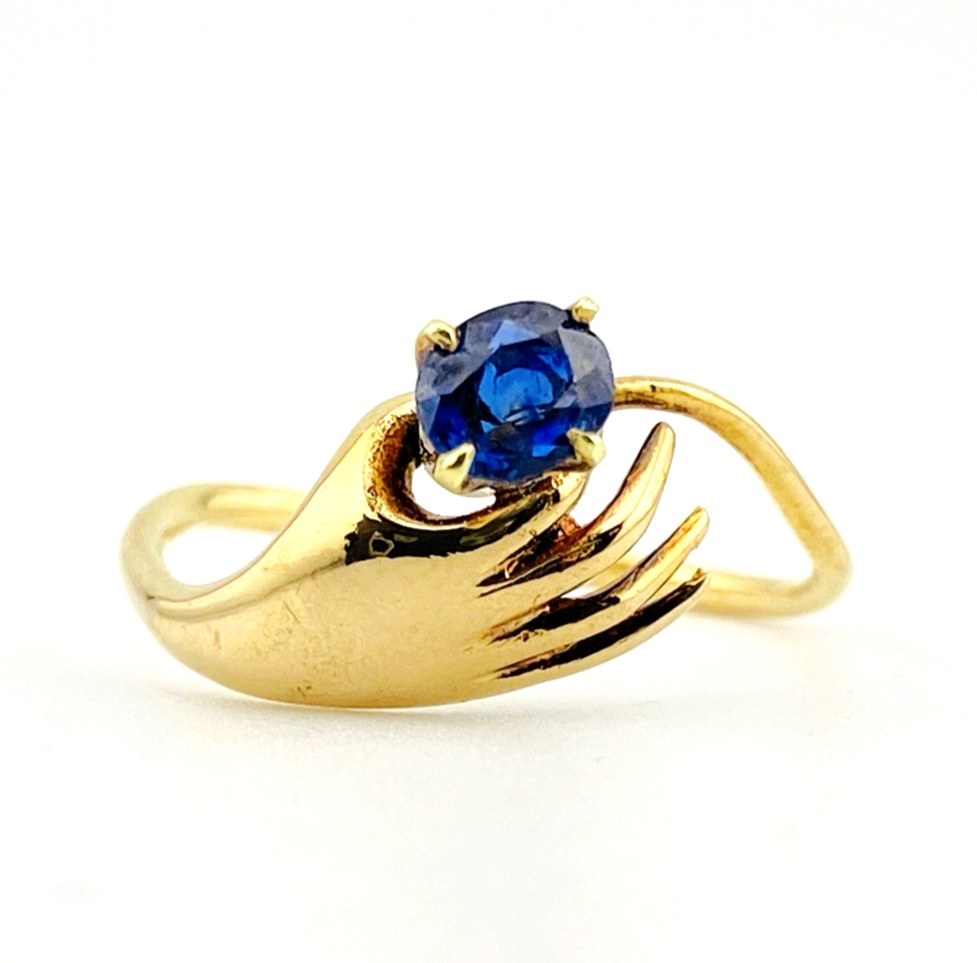 Hand Offering a Sapphire 14k Gold Ring