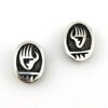 Vintage sterling silver clip earrings shaped as bear claws with textured backs and six pointed star maker mark
