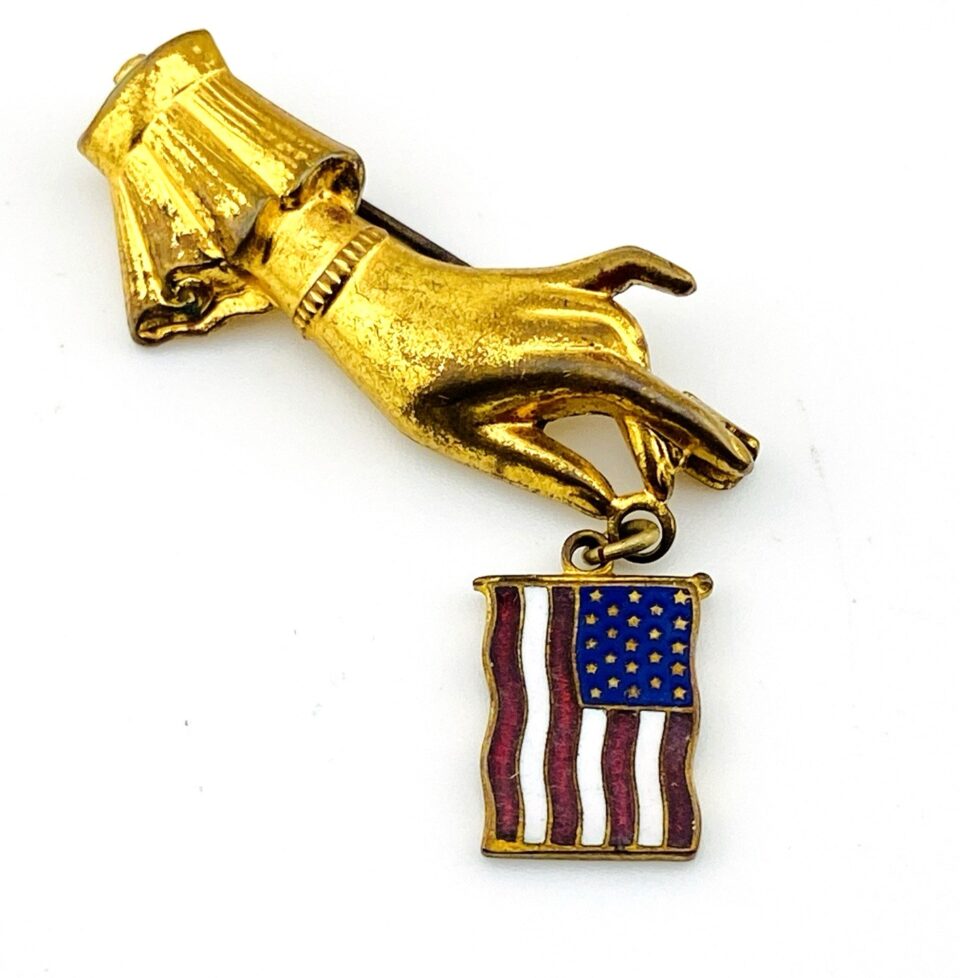 Hand Holding American Flag Brooch Pin