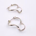 Asymmetrical Twist Silver Tone Hoop Earrings - Modernist Design