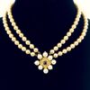 Renaissance style pearl necklace with garnet quatrefoil clasp