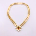 Renaissance style pearl necklace with garnet quatrefoil clasp