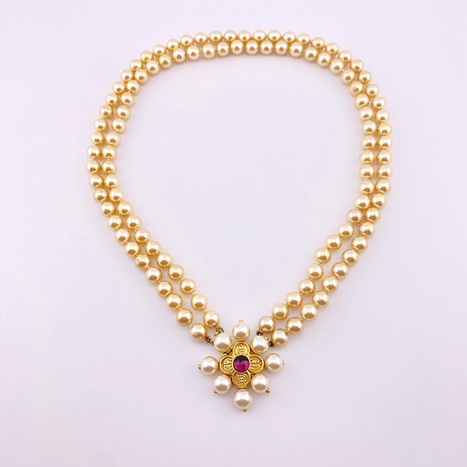 Renaissance style pearl necklace with garnet quatrefoil clasp