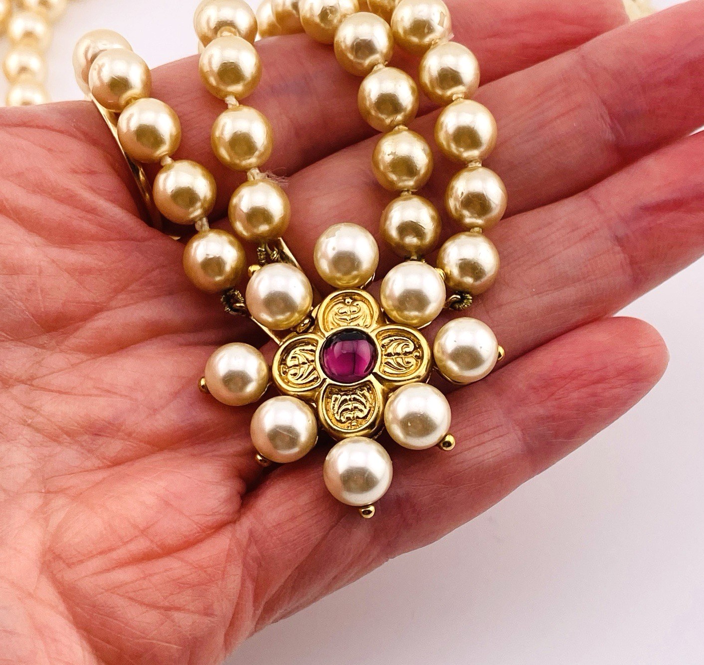 Renaissance style pearl necklace with garnet quatrefoil clasp