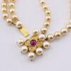 Renaissance style pearl necklace with garnet quatrefoil clasp