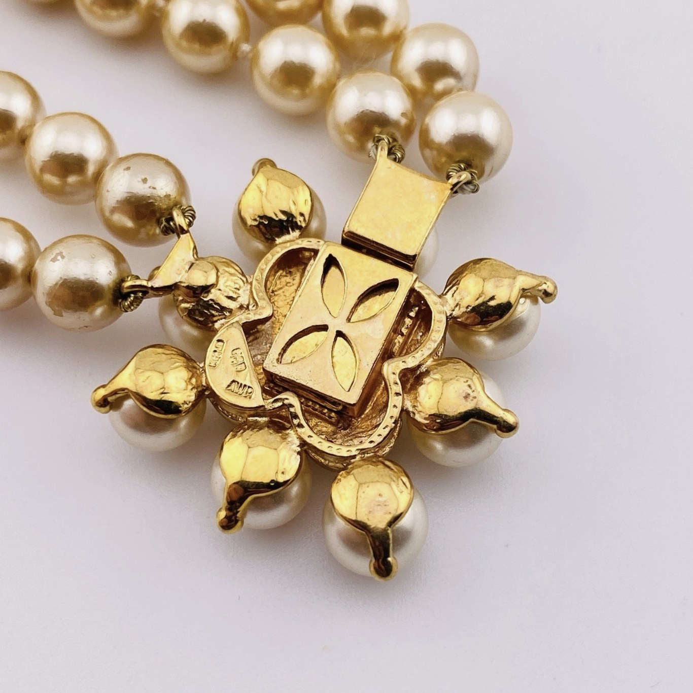 Renaissance style pearl necklace with garnet quatrefoil clasp