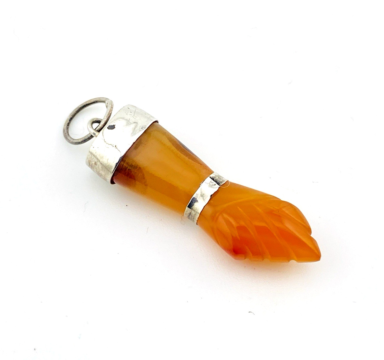 Hand carved, smooth carnelian good luck pendant top view