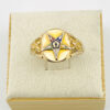 Front view of a vintage Eastern Star Masonic signet ring showing multicolor enamel star detail