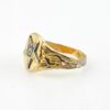 Side view of a vintage Eastern Star Masonic signet ring showing multicolor enamel star detail