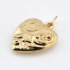 Side view showing the repousse work - Victorian puffy heart charm.