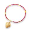 Rhodolite garnet and 14k gold bracelet styled with an antique Victorian gold puffy heart charm pendant for a layered look