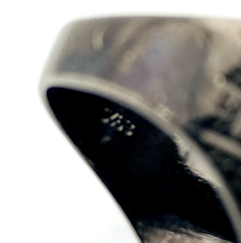 Black rhodium sterling silver statement ring with gold coral branch design and pear-shaped amethyst color stones in an elongated oval silhouette - 925 mark