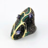 Black rhodium sterling silver statement ring with gold accents, green cubic zirconia, and pear-shaped amethyst stones in an elongated modernist design