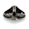 Black rhodium sterling silver statement ring with gold accents, green cubic zirconia, and pear-shaped amethyst stones in an elongated modernist design