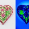 Vintage Dorothy Bauer heart brooch with pink clear and uranium green rhinestone flowers in silver plated metal