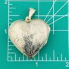 Large engraved sterling silver puffy heart locket pendant that opens to hold two photographs