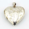 Large engraved sterling silver puffy heart locket pendant that opens to hold two photographs