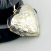 Large engraved sterling silver puffy heart locket pendant that opens to hold two photographs