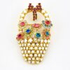 Signed Dorothy Bauer vintage gold tone flower basket brooch with pastel Swarovski crystals and red bow detail