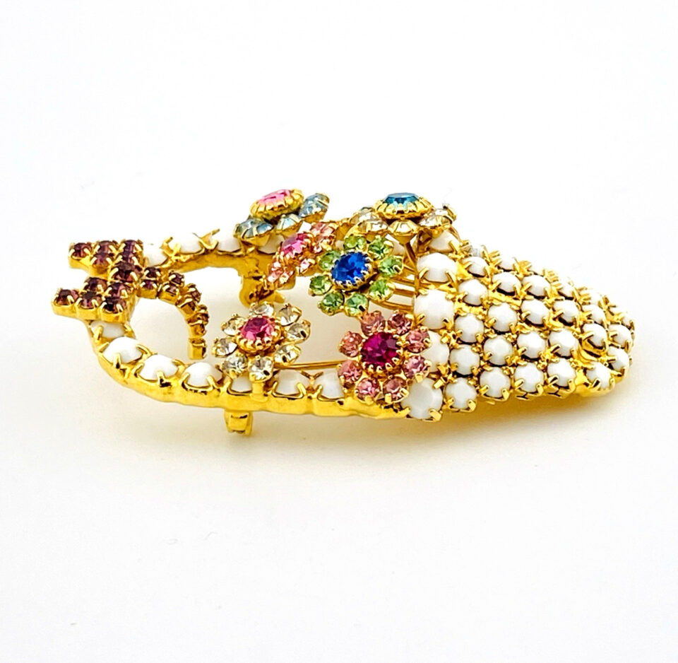 Signed Dorothy Bauer vintage gold tone flower basket brooch with pastel Swarovski crystals and red bow detail