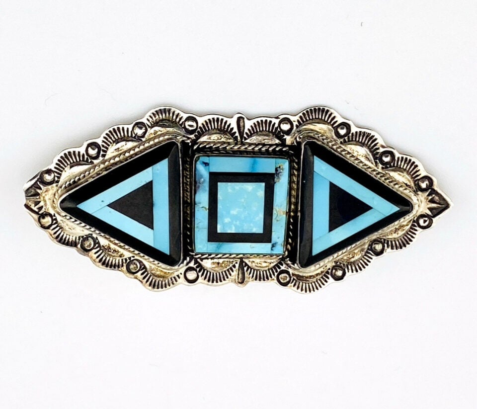 Sterling silver Southwestern brooch with geometric turquoise and black onyx inlay and stamped silver border
