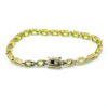 Vintage gold over sterling silver line bracelet with twenty oval faceted peridot gemstones arranged in a continuous row