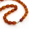 Antique Art Deco amber necklace with matte faceted graduated beads