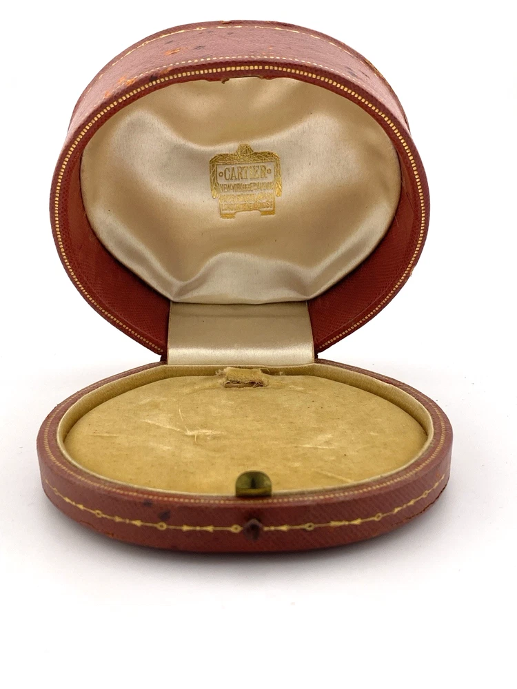 Antique Cartier leather jewelry presentation box with gilded garland border and silk velvet interior