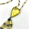 Antique uranium glass flapper necklace with tassel drop and pear shaped Vaseline glass pendant