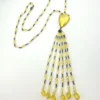 Antique uranium glass flapper necklace with tassel drop and pear shaped Vaseline glass pendant