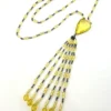 Antique uranium glass flapper necklace with tassel drop and pear shaped Vaseline glass pendant