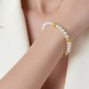 14k gold pearl bracelet with cultured freshwater pearls and gold accent beads stackable 7 inch close up