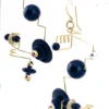 Modernist geometric dangle earrings in gold filled wire with black glass beads sculptural design