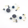 Modernist geometric dangle earrings in gold filled wire with black glass beads sculptural design